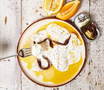 Discover a creamy burrata recipe featuring GOOD PHATS Organic Extra Virgin Olive Oil, anchovies, lemon zest, and a touch of sea salt for the perfect appetiser.
