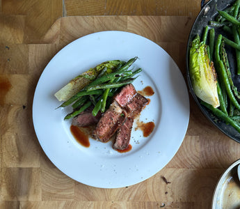 Steak and blistered greens